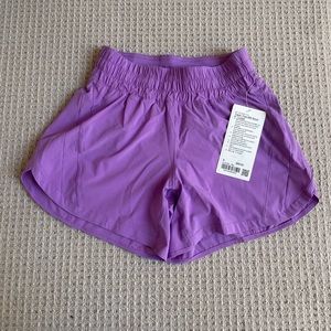 Track that mid rise lined 5” short in purple blossom light